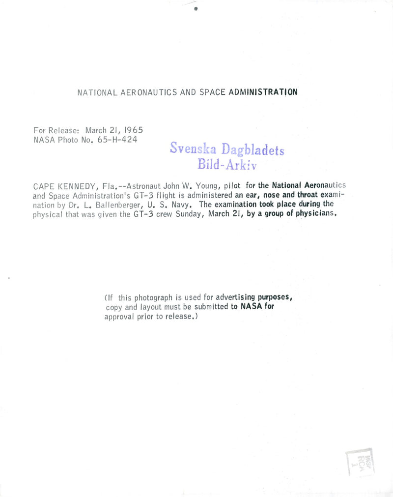 Dr. L. Ballenberger examines astronaut John W. Young - Vintage Photograph