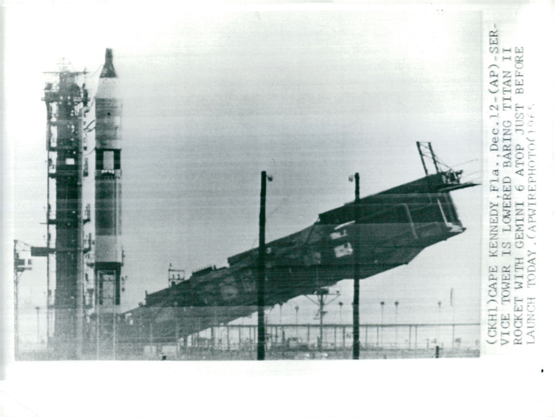 The service tower is dropped below the Gemini 6 countdown - Vintage Photograph