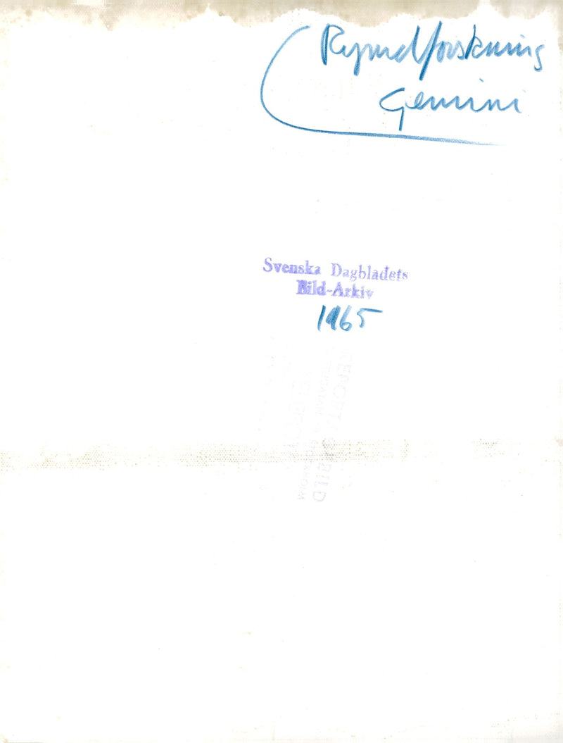 A space engineer demonstrates how astronaut Edward H. White II will use an "aerospace gun" with oxygen - Vintage Photograph