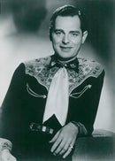 Frank Cook offers music news in China's August program - Vintage Photograph