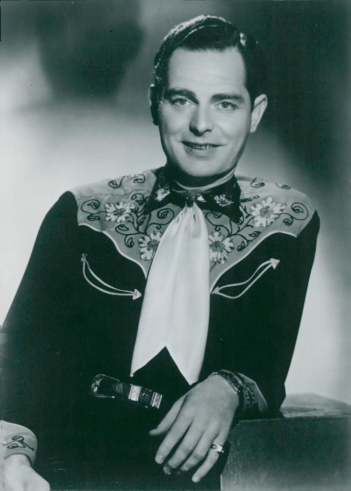 Frank Cook offers music news in China's August program - Vintage Photograph