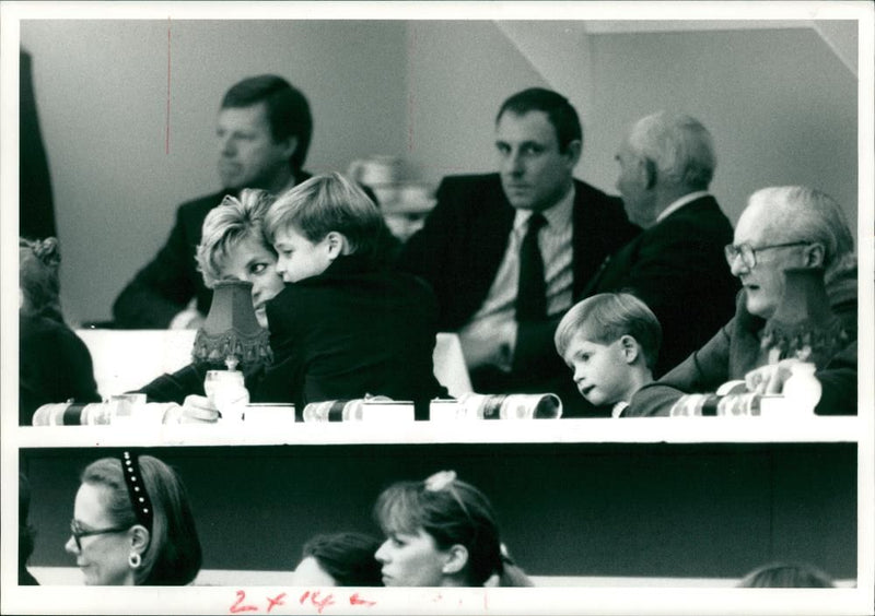 Prince William clunches his mom the Princess of wales. - Vintage Photograph