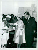 English Queen Elizabeth and the Duke of Edinburgh receive the "Book of Ghandi" during their visit to the Shrine in 1961 - Vintage Photograph