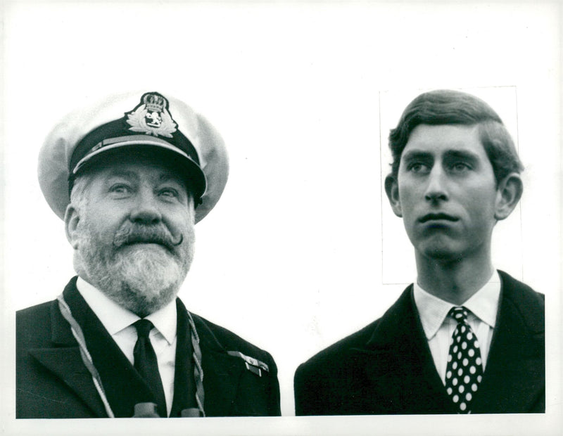 Prince Charles of Wales together with Captain Bill Warwick aboard Queen Elizabeth II. - Vintage Photograph