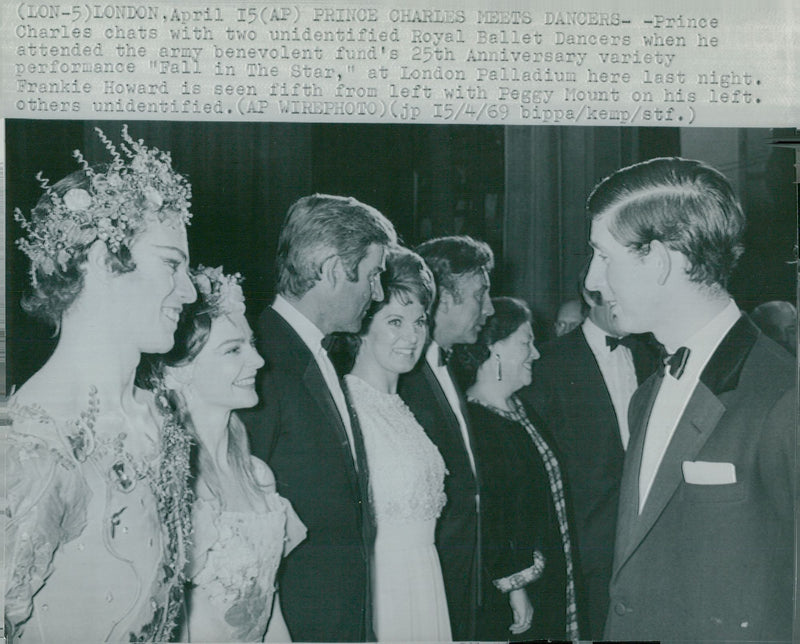 Prince Charles of Wales talks with the dances of the Fall in The Star at the London Palladium. - Vintage Photograph