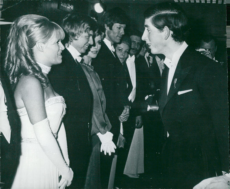 Prince Charles of Wales talks with Carol White and Tommy Steele during a gala premier. - Vintage Photograph