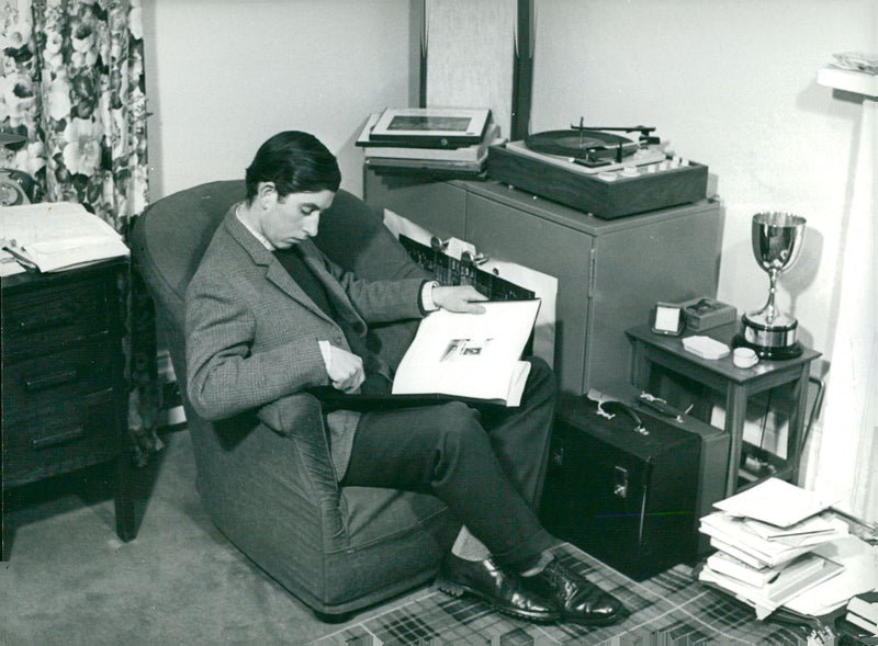 Prince Charles of Wales in his student room at Trinity College. - Vintage Photograph