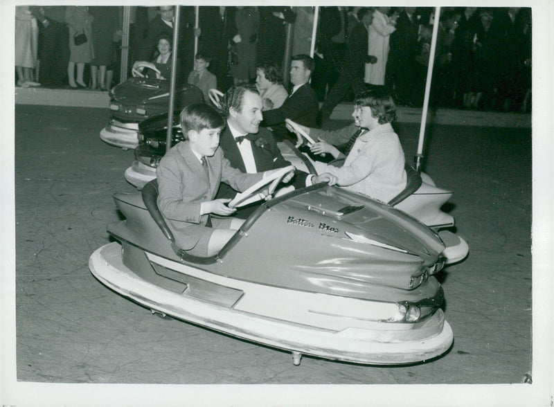 Prince Charles is driving a car at Bertram Mill's Circus & Fun Fair - Vintage Photograph