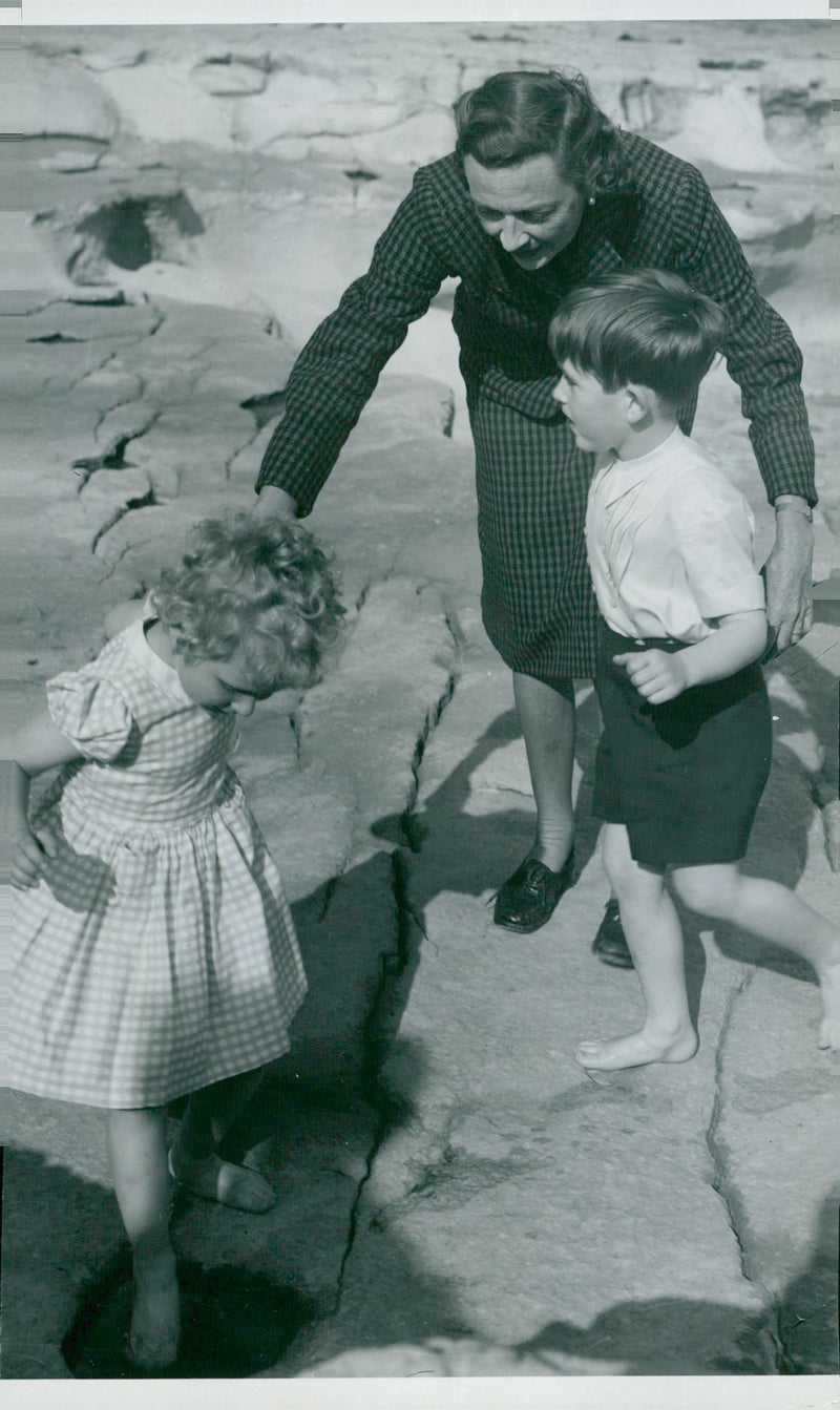 Princess Anne and Prince Charles play on the beach with the lady Mountbatten - Vintage Photograph