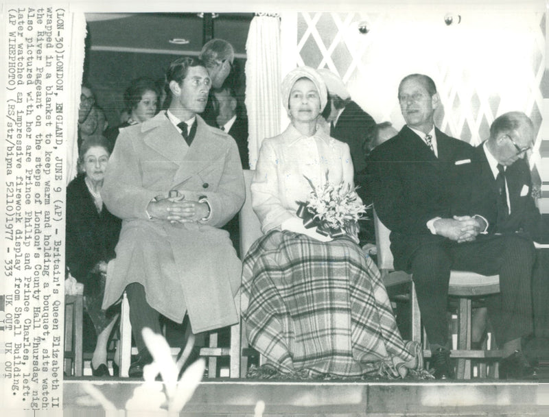 English Queen Elizabeth II views the River Pageant together with Prince Philip and Prince Charles - Vintage Photograph