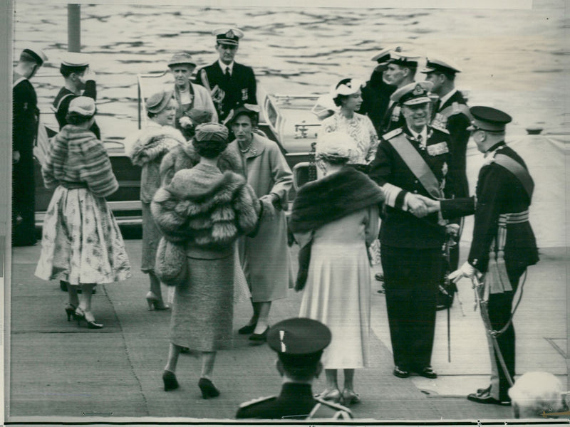 King Gustaf VI Adolf is welcomed by the Duke of Gloucester while Queen Louise is welcomed by Queen Elizabeth II, Duchess of Kent, Duchess of Gloucester and Princess Margaret - Vintage Photograph