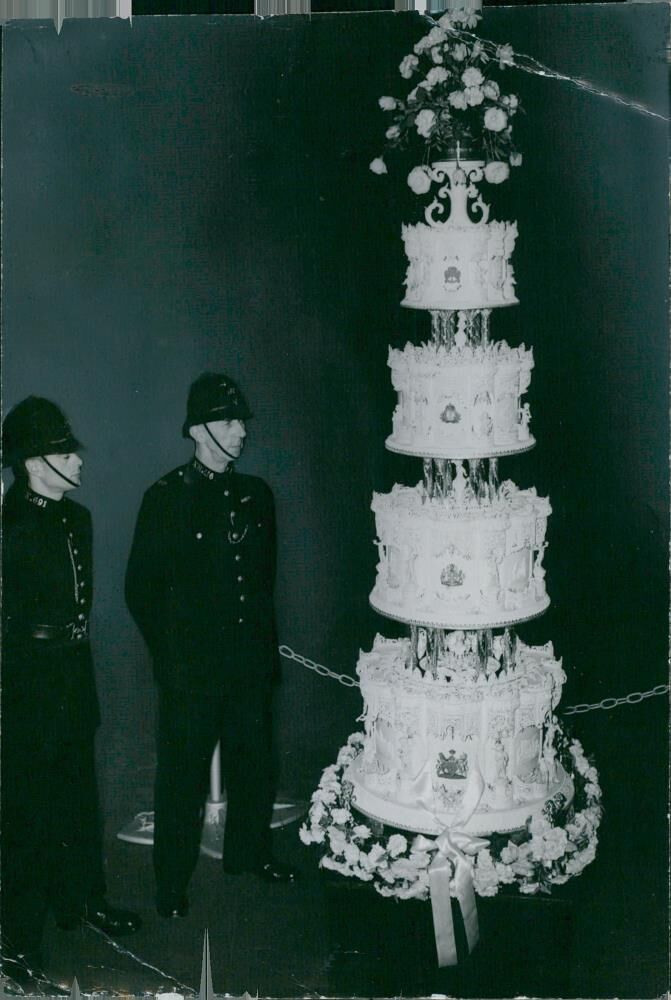 Queen Elizabeth II's wedding cake is guarded by two police officers - Vintage Photograph