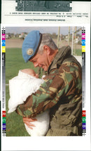 Army officer with his baby. - Vintage Photograph