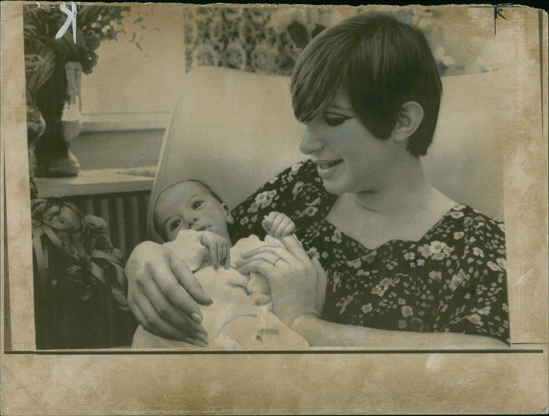 Actress Barbra Streisand holding her son Jason Emanuel. - Vintage Photograph