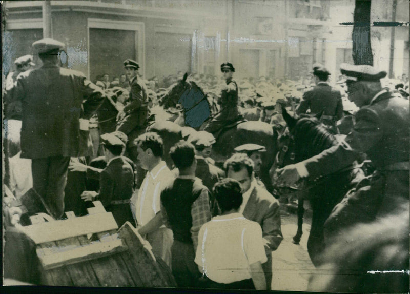 Mounted police breaking up fighting. - Vintage Photograph