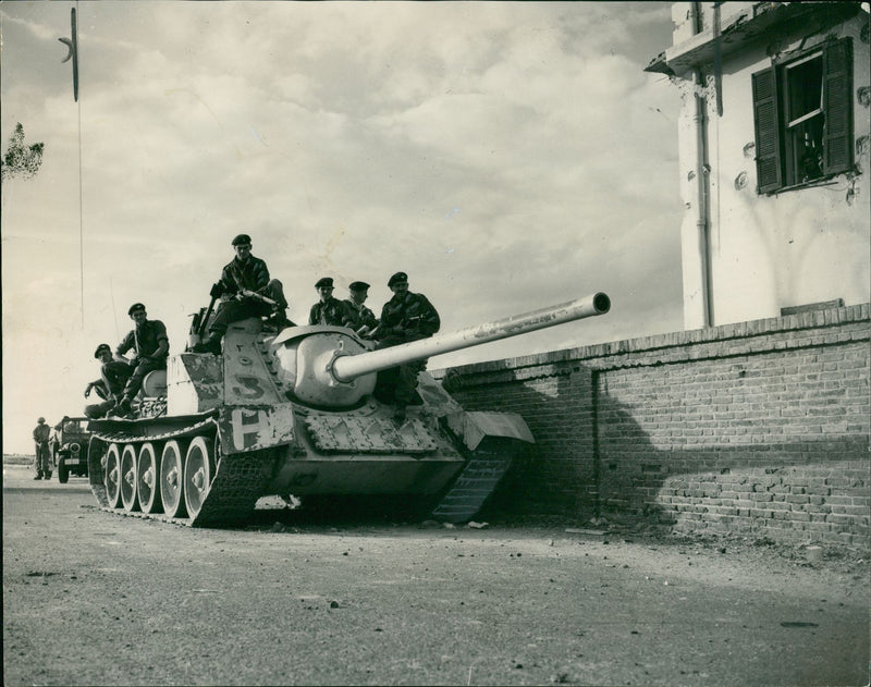 British paratroops sitting on a captured Russian tank. - Vintage Photograph