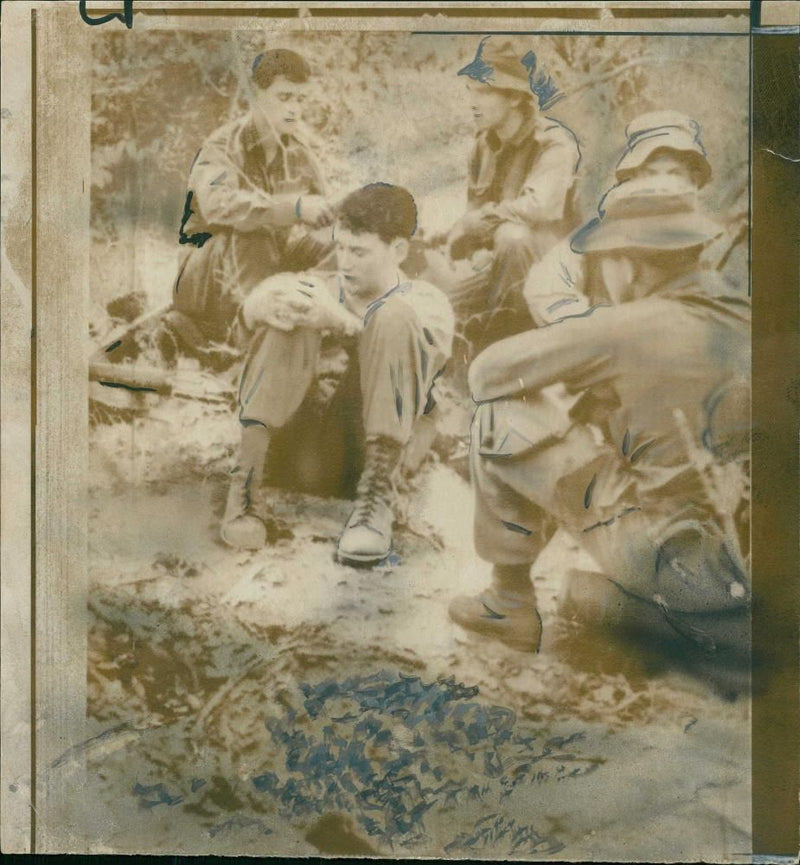 Australian troops sitting beside a crater during Vietnam War - Vintage Photograph