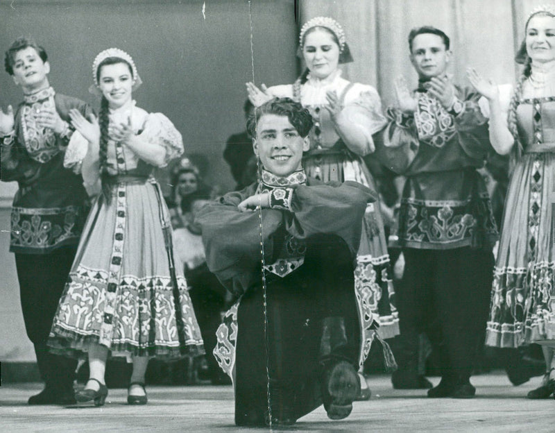 The Russian Piatnit Scouter makes a success with both dance and song in the Concert Hall. - Vintage Photograph