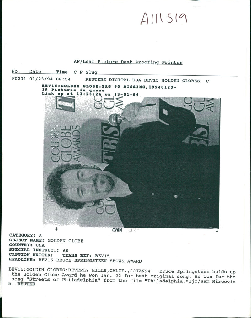 Bruce springsteen HOLDS up the golden globe award. - Vintage Photograph