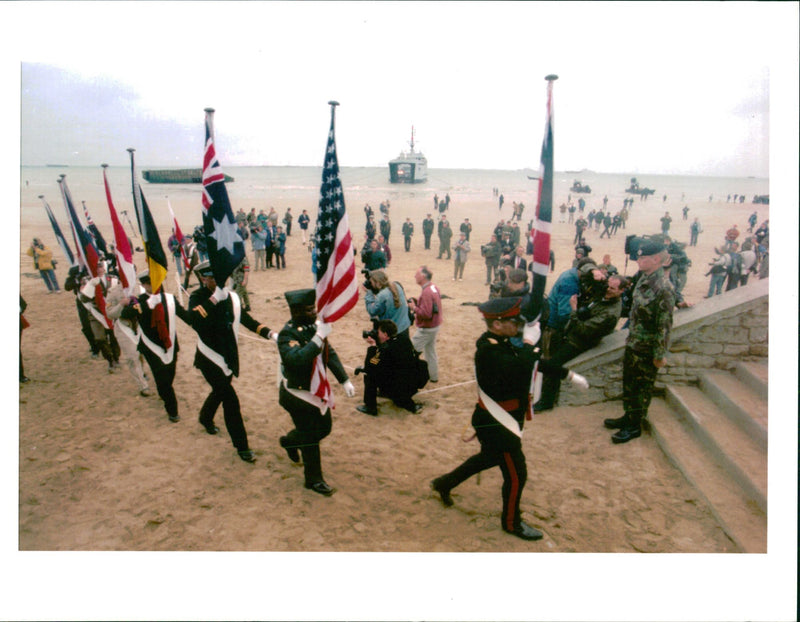 dday standars arriving on beach at arromanches - Vintage Photograph