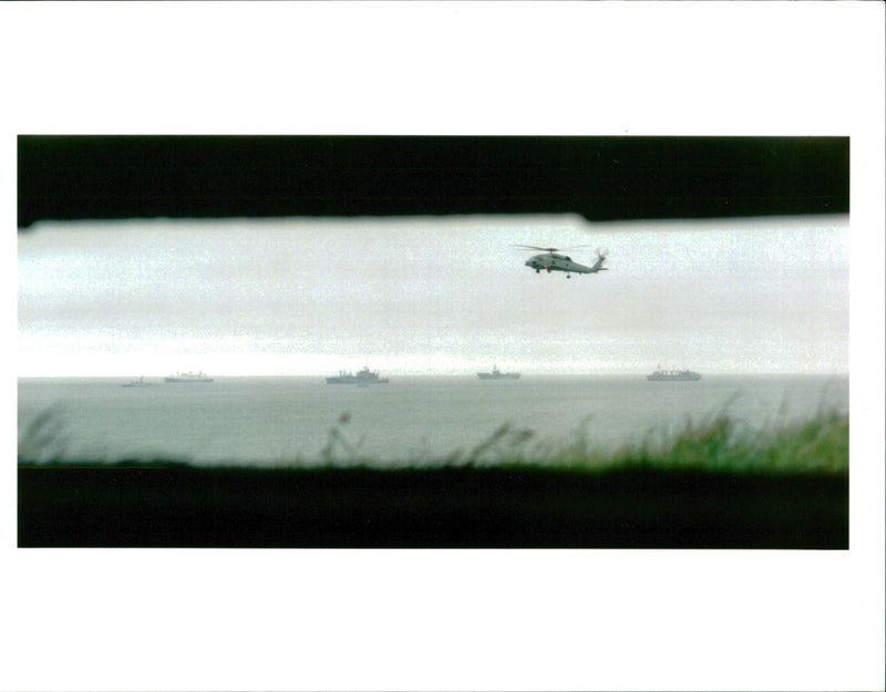 helicopter flies over usa and other allied warships - Vintage Photograph
