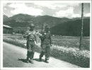 Two soldiers walking. - Vintage Photograph