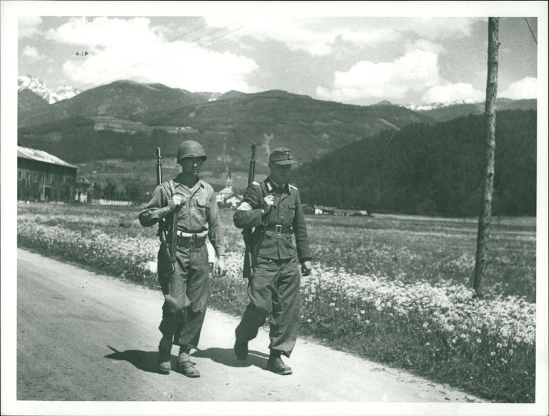 Two soldiers walking. - Vintage Photograph