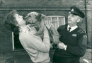 trapped terrier dog handed to his master - Vintage Photograph