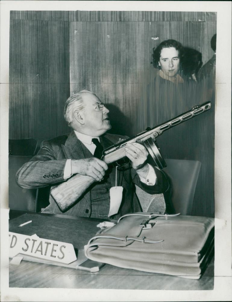 Mr.Warren Austin Displaying a Russian Sub-Machine Gun. - Vintage Photograph