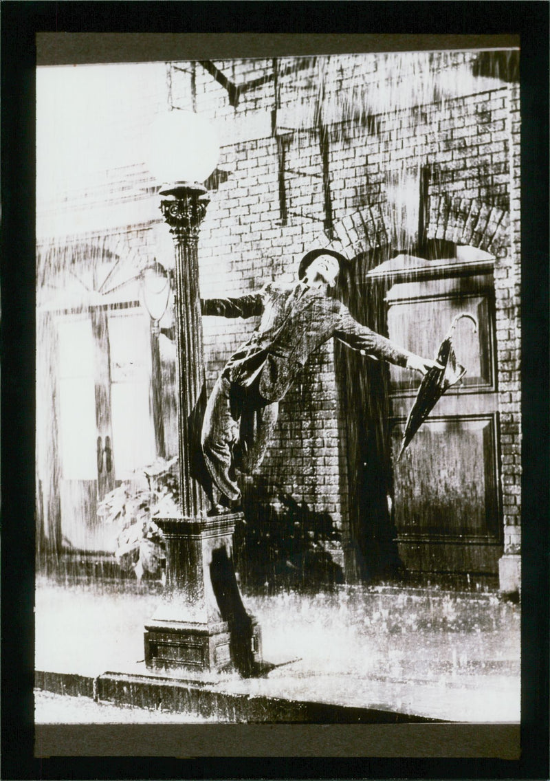 Gene Kelly in musical comedy film 'Singin' in the Rain' - Vintage Photograph