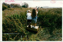 Birdwatchers taking a view of the birdlife at Egleton Nature Reserve - Vintage Photograph