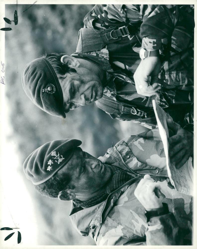 An officer of the spanish marines conferring with a member. - Vintage Photograph