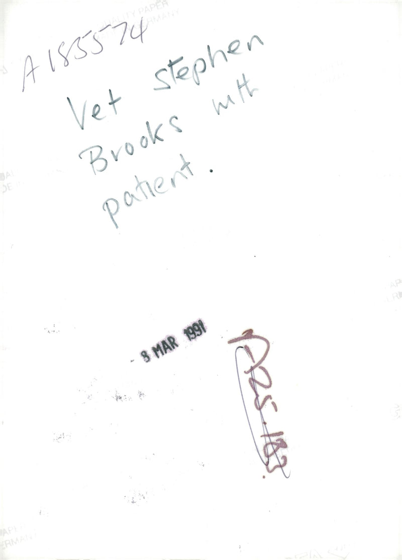 Vet stephen brooks with patient. - Vintage Photograph