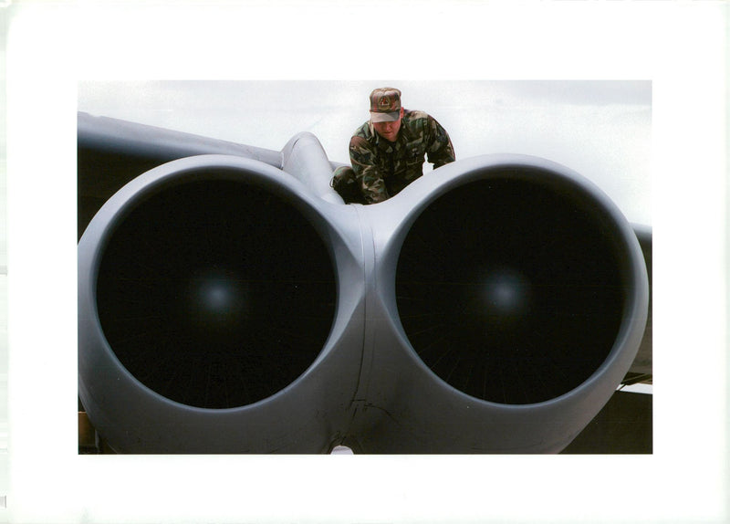 Maintenance begins on the huge B-52 engines. - Vintage Photograph