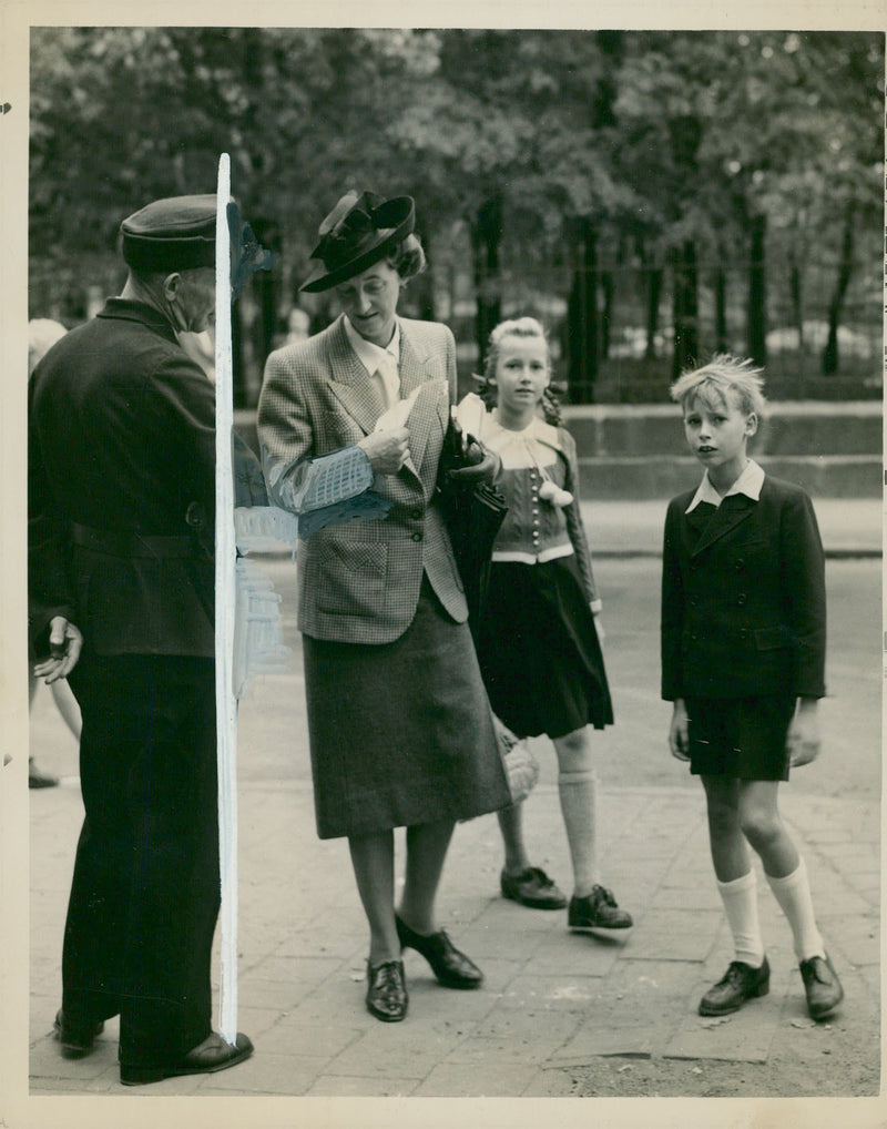 Frau Frick and her Children are seen entering the Nuerberg Prison to visit  Wilhem Rick. - Vintage Photograph