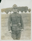 A soldier standing on the field. - Vintage Photograph