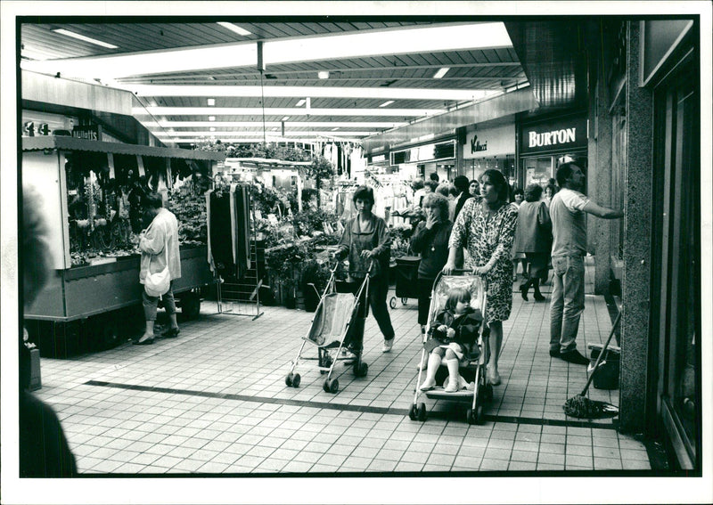 Women shopping with their children in busy shopping centre at Stratford - Vintage Photograph