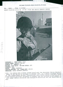 An Indian soldier stands guard near the Hazratbal Shrine - Vintage Photograph