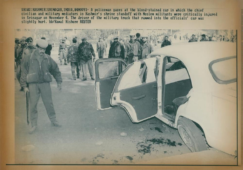 A policeman gazes at the blood-stained car - Vintage Photograph