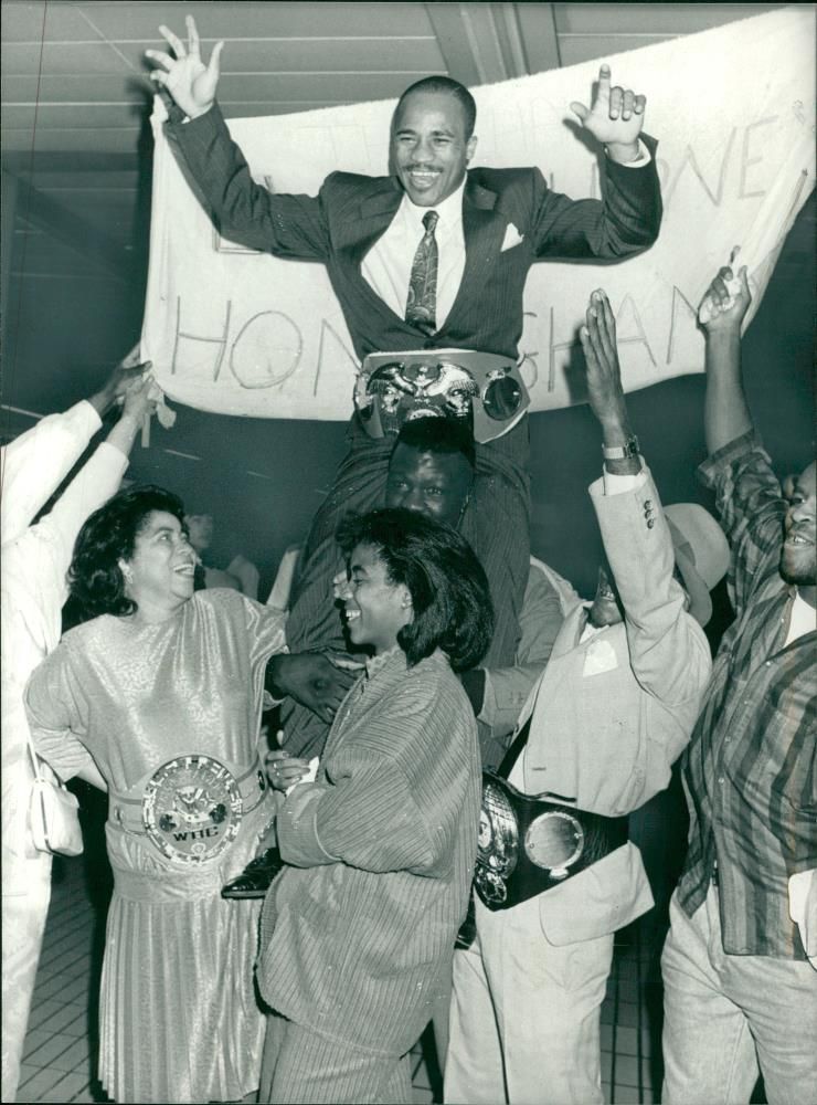Lloyd Honeyghan with his parents. - Vintage Photograph