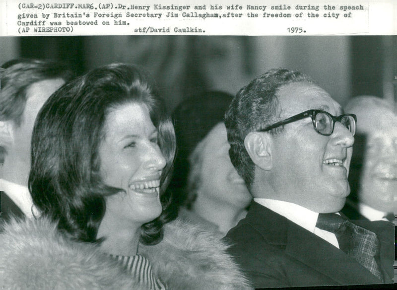 Henry Kissinger and his wife Nancy during a speech by British Foreign Minister Jim Callagham - Vintage Photograph