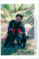 Eartha Kitt together with their dogs during a "Dog Walk" against cancer in Riverside Park - Vintage Photograph