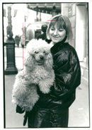 Karine gasnot with her 3 year old french poodle biba in the rue maboeuf. - Vintage Photograph