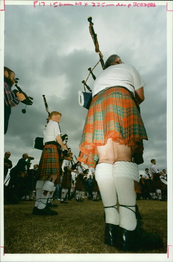 musical instruments bag pipes: pipers in the park. - Vintage Photograph