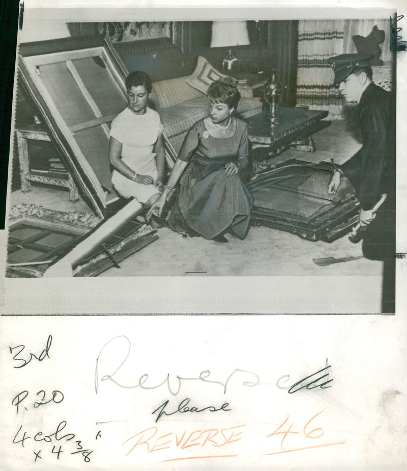 David Bright's wife looking at stolen paintings - Vintage Photograph