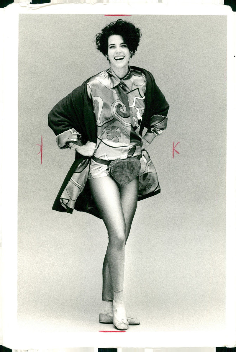 Fashion and red wool nylon swing coat with pucci style print lining in purple. - Vintage Photograph