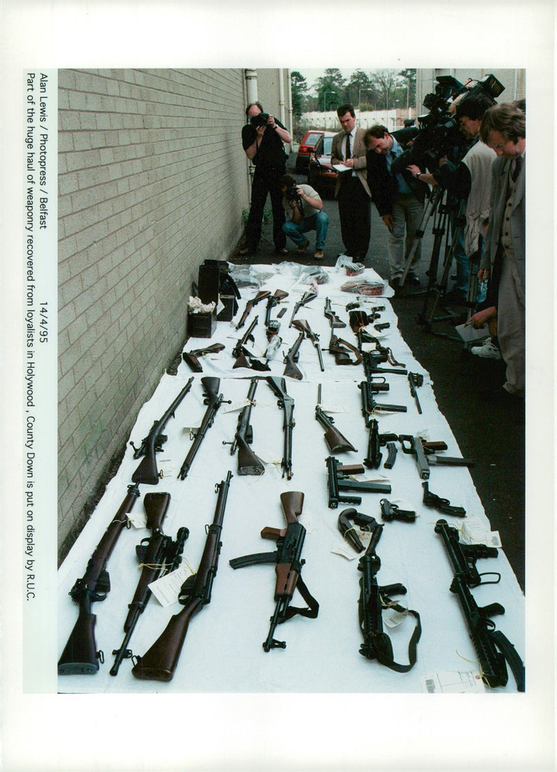 sub machine gun and AK47 assault rifles. - Vintage Photograph