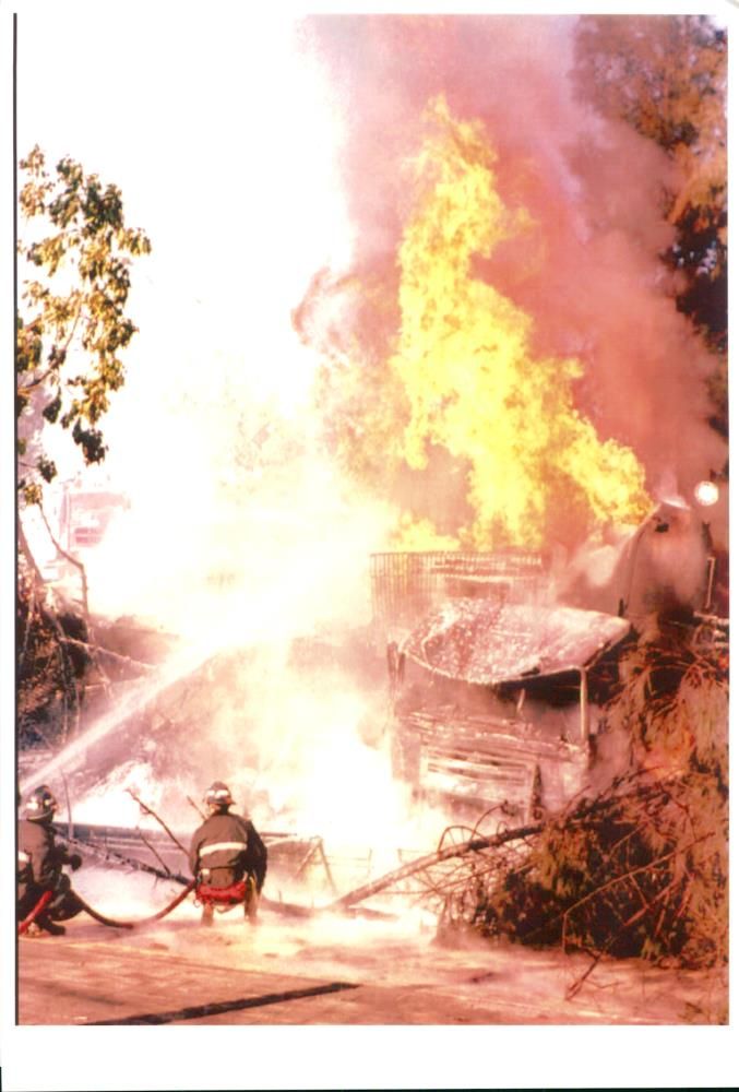 Spain fires and firefighter house down a burining oil tanker. - Vintage Photograph