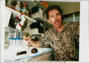 Animal: Dr jeffrey friedman with mice. - Vintage Photograph