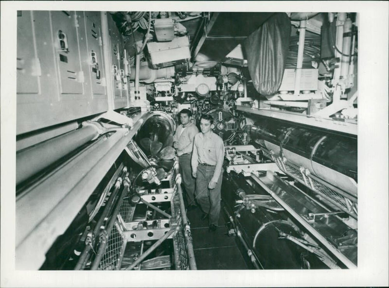 Loading a tin fish. - Vintage Photograph